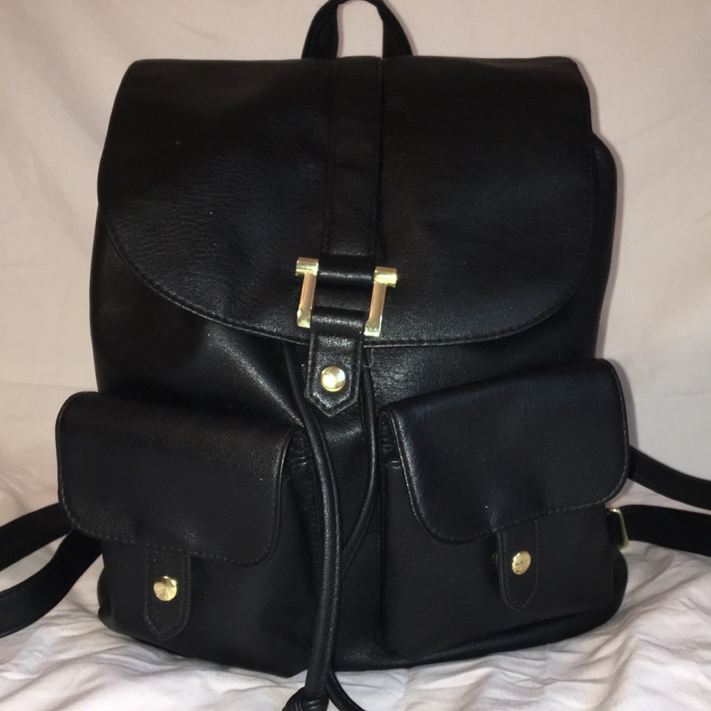 Black  faux leather and gold front pocket backpack